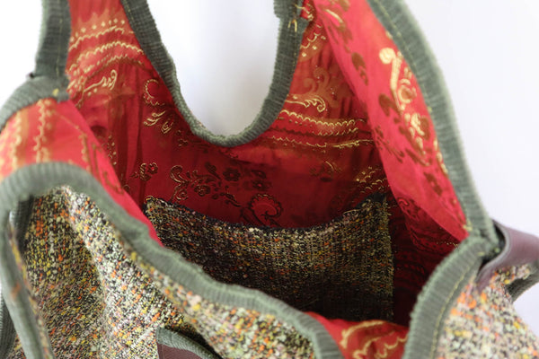 QUARTIERI Borsa in tessuto dai toni verdi e arancio, cucita a mano