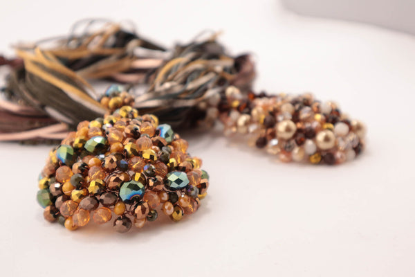 Collana torchon con fasce di ecopelle sottili e perle bronzo
